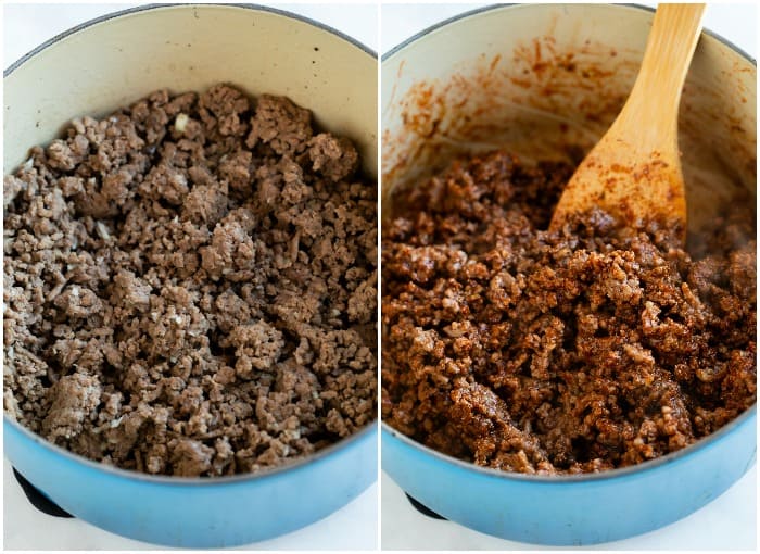 Ground beef in a dutch oven with seasonings being added to make chili.