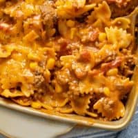 A close up view of pasta in a sloppy joe sauce in a casserole dish.