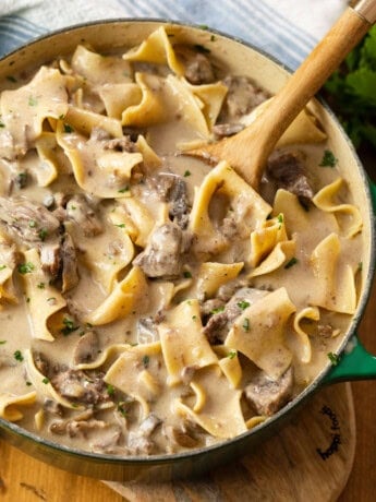 A dutch oven filled with hearty Beef Stroganoff made in the Slow Cooker.
