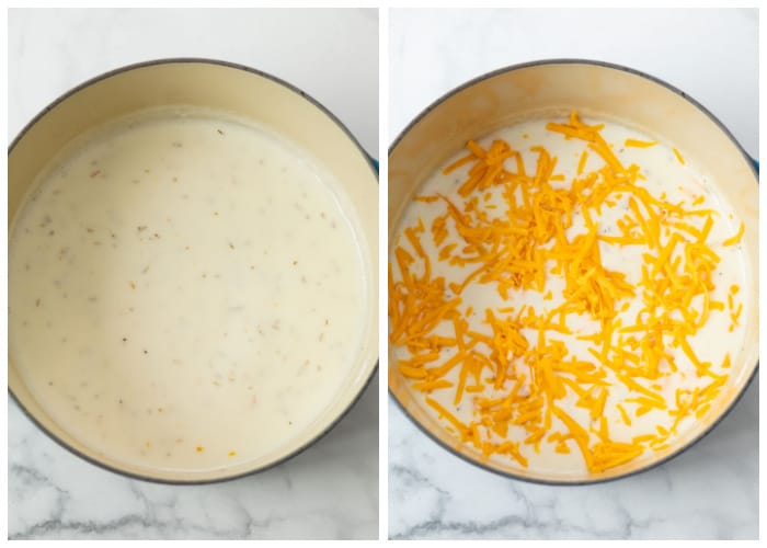 White sauce in a dutch oven with shredded cheese being added to make scalloped potatoes.