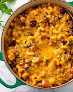 A Dutch oven filled with Cheesy Chili Mac.