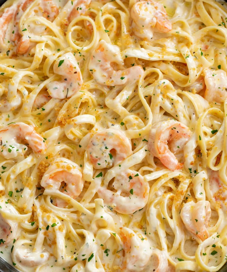 Shrimp Alfredo with Fettucine and roughly chopped parsley.
