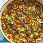 Beef Noodle Soup in a blue dutch oven.